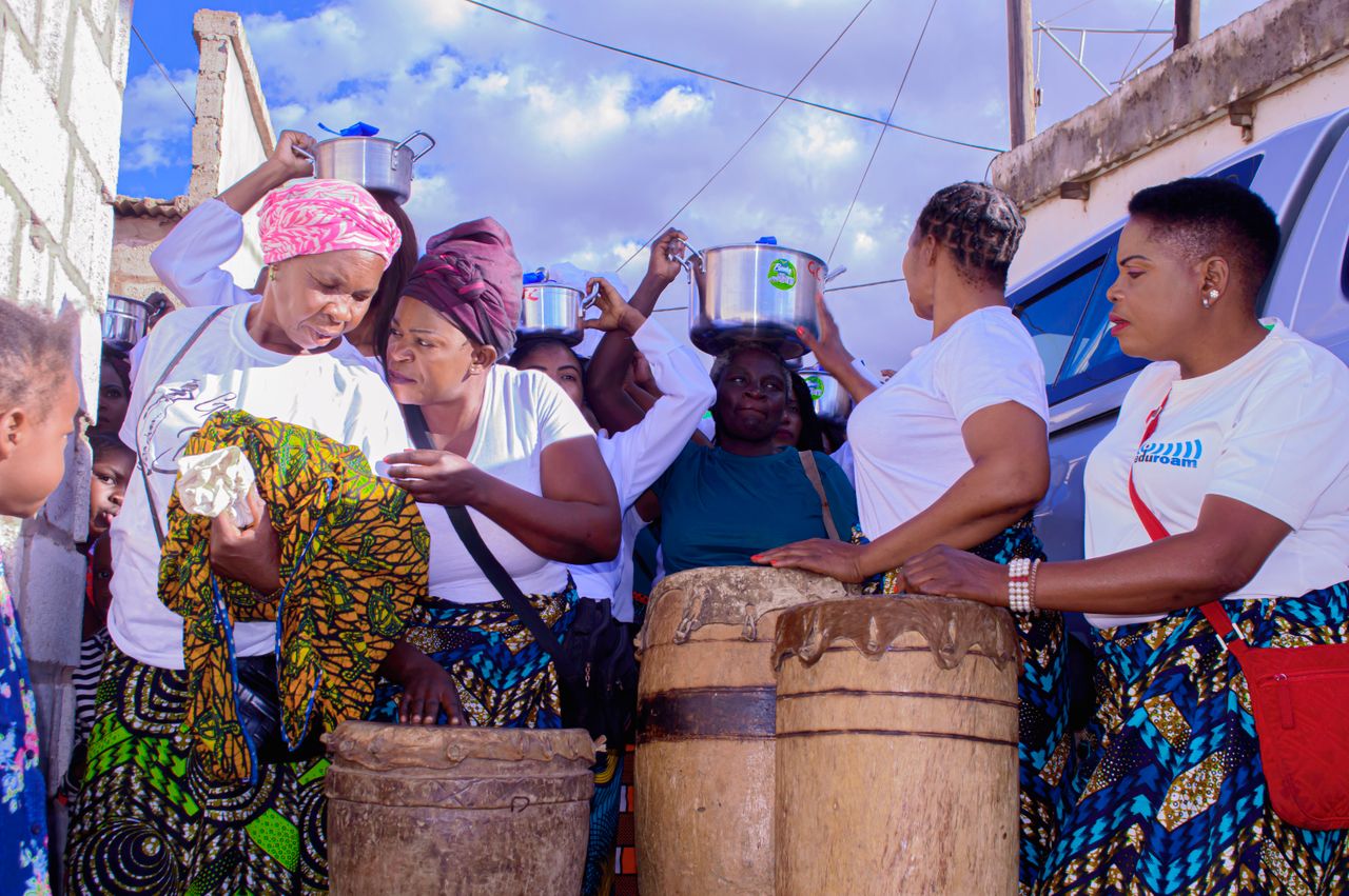 Crafting Captivating Headlines: Your awesome post title goes here A lively group of women celebrating with music and traditional drumming outdoors.